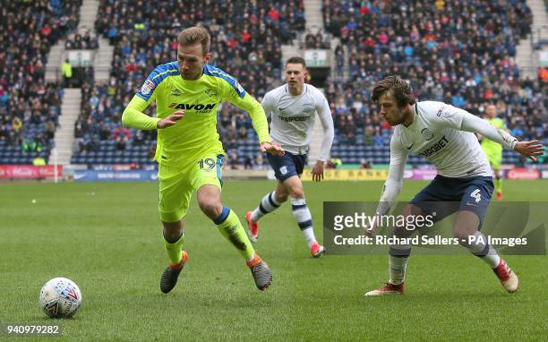 Derby County's Andreas Weimann and Preston North End's Ben Pearson battle for the ball during the Championship match at Deepdale, Preston.
