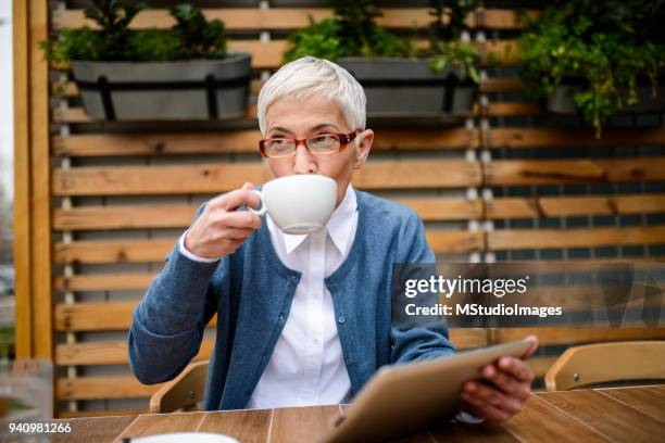 coffee time. - senior women cafe stock pictures, royalty-free photos & images