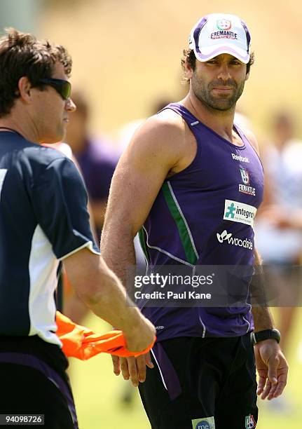 Dean Solomon of the Dockers looks back at Mark Harvey, coach of the Dockers during a Fremantle Dockers AFL training session at Santich Park on...