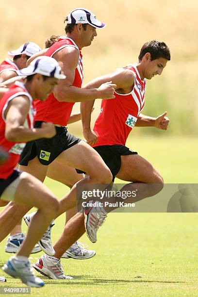 Matthew Pavlich of the Dockers leads his team-mates in a warmup drill during a Fremantle Dockers AFL training session at Santich Park on December 7,...