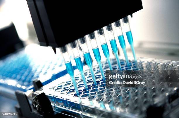 medical  research and pharmaceutical research : robotic pipette device - test tube stock pictures, royalty-free photos & images