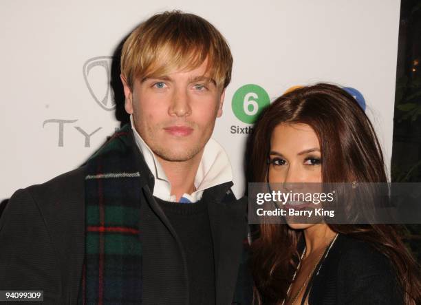 Model Rowly Dennis and actress Rachel Sterling attend an AIDS Marathon Charity event held at Janes House on December 6, 2009 in Hollywood, California.