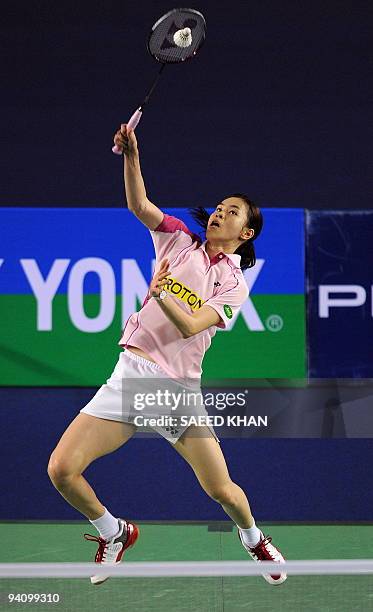 Wong Mew Choo of Malaysia smashes a return to Yao Jie of the Netherlands in the first women's semi-final match at the Badminton World Super Series...