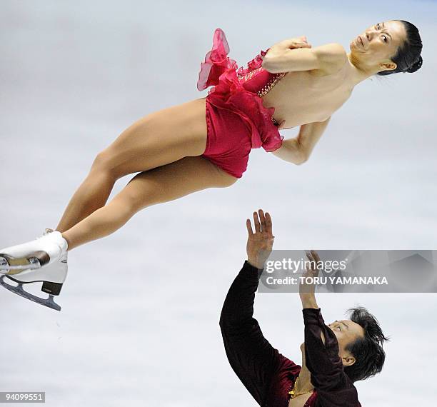 Chinese skater Zhao Hongbo tosses his partner Shen Xue during the free skating of the pair's competition at the figure skating ISU Grand Prix Final...