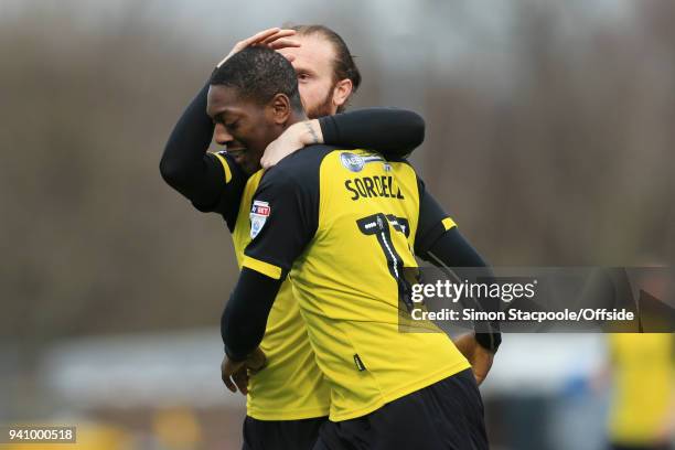 Marvin Sordell of Burton celebrates with teammate John Brayford of Burton after scoring their 1st goal during the Sky Bet Championship match between...