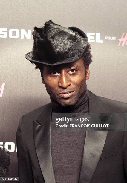 Nigerian singer and guitarist Keziah Jones poses as he arrives for the presentation of Sonia Rykiel for Swedish high-street clothing chain H&M...