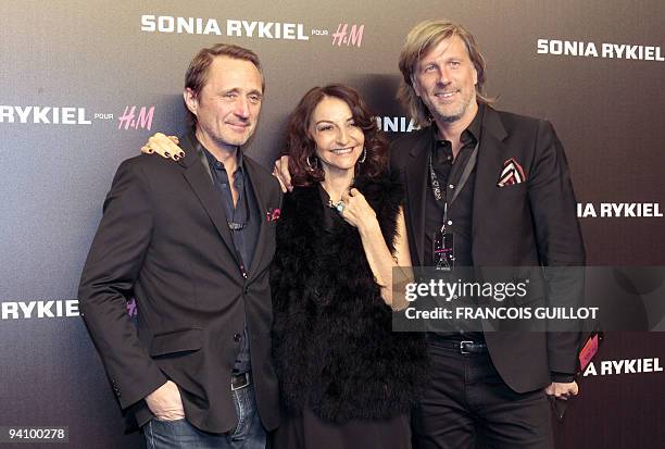 Jewellery designer Herve Van Der Straeten and an unidentified man are welcomed by French designer Nathalie Rykiel , daughter of designer Sonia Rykiel...