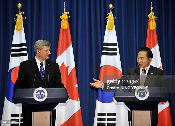 South Korean President Lee Myung-Bak and Canadian Prime Minister Stephen Harper hold a joint press conference after their meeting at the presidential...
