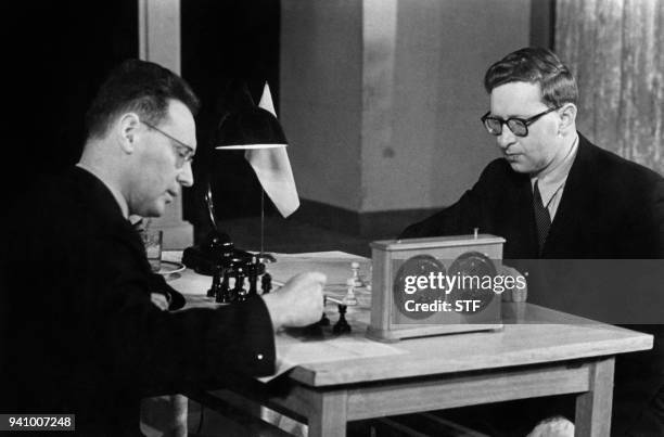 Soviet World Chess champion Mikhail Botvinnik plays against Soviet Chess player Vasily Smyslov during World Chess Championship in 1954.