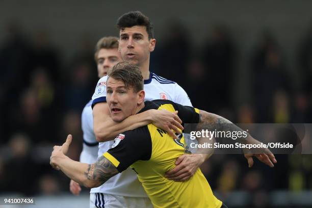 Daniel Ayala of Boro grapples wuth Kyle McFadzean of Burton during the Sky Bet Championship match between Burton Albion and Middlesbrough at the...