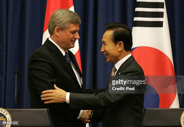 Canadian Prime Minister Stephen Harper and South Korean President Lee Myung-Bak attend a joint press conference at the presidential house on December...