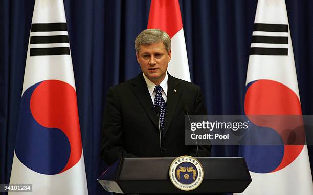 Canadian Prime Minister Stephen Harper attends a joint press conference with South Korean President Lee Myung-Bak at the presidential house on...