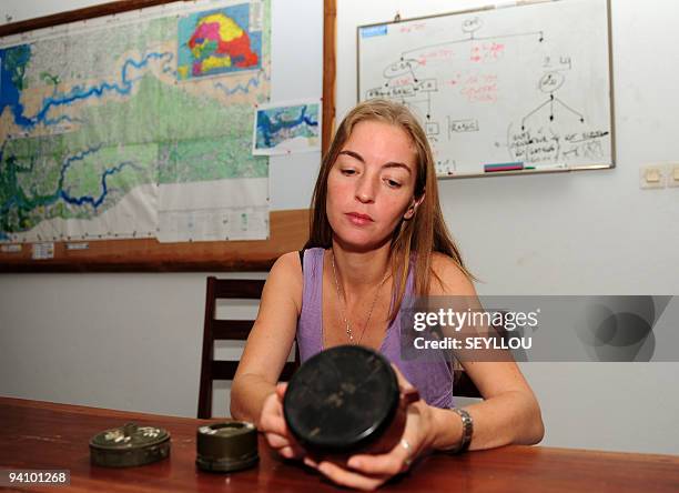 French Camille Aubourg, in charge of local demining operations for the French non-governmental organization Handicap International, shows on December...