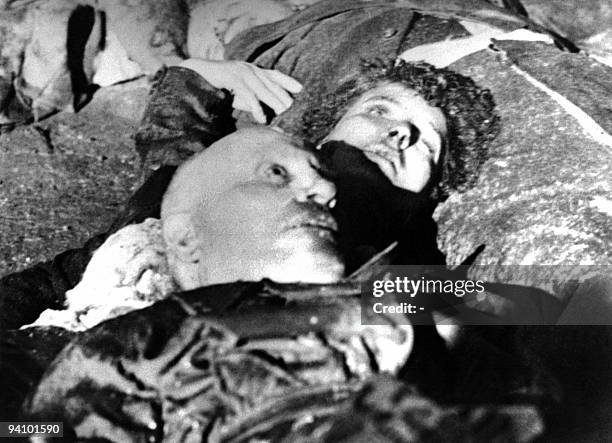 The corpses of Italian dictator Benito Mussolini and his mistress Claretta Petacci lie on the ground, April 28 after they were executed by Italian...