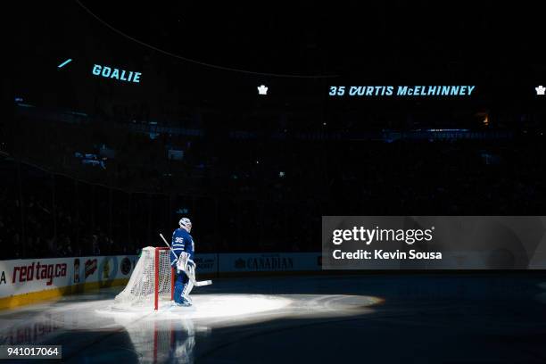 Curtis McElhinney of the Toronto Maple Leafs stands in his net during introductions before playing the Winnipeg Jets at the Air Canada Centre on...