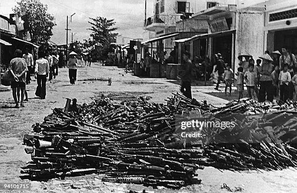 May 1975 photo shows a large pile of US-made rifles abandoned by pro-American Southern Vietnamese army soldiers collected at Nhan Nghia commune, Chau...