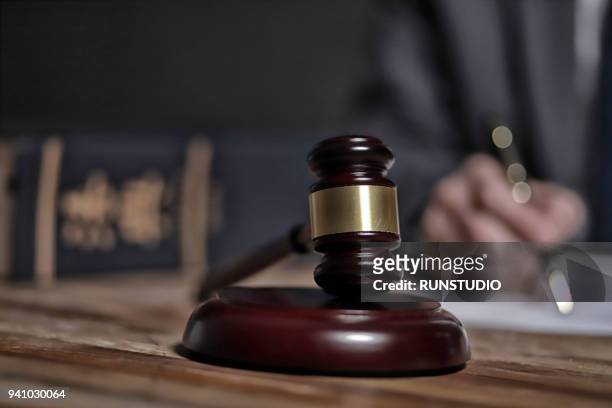 lawyer writing documents - justice concept stock-fotos und bilder