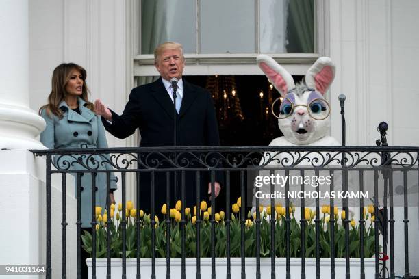 President Donald Trump, with First Lady Melania Trump, speaks during the annual Easter Egg Roll at the White House in Washington, DC, on April 2,...