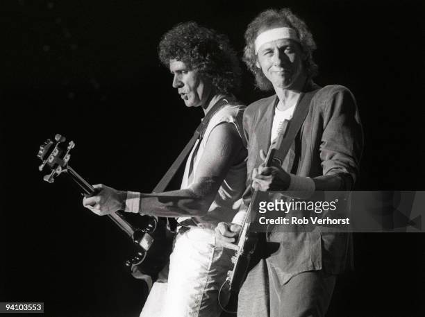 John Illsley and Mark Knopfler from Dire Straits perform live on stage at Ahoy, Rotterdam, Holland on May 25 1985