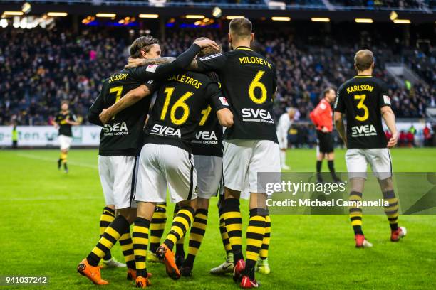 Anton Saletros, Alexander Milosevic, and Kristoffer Olsson of AIK celebrate scoring the 2-0 during an Allsvenskan match between AIK and Dalkurd FF at...