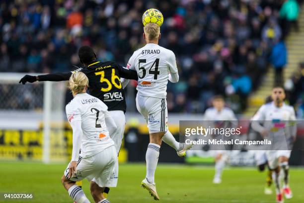 Henok Goitom of AIK loses an arial duel to Simon Strand of Dalkurd FF during an Allsvenskan match between AIK and Dalkurd FF at Friends arena on...