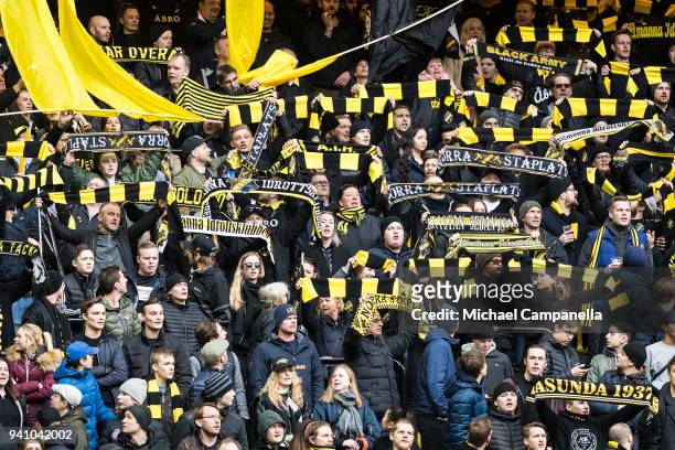 Supporters hold up scarves during an Allsvenskan match between AIK and Dalkurd FF at Friends arena on April 2, 2018 in Solna, Sweden.