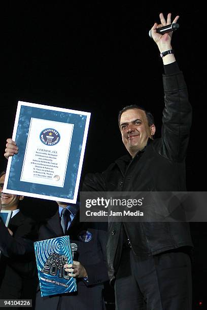 Head of Government of the Federal District Marcelo Ebrard displays the Records Guinness certificate for the biggest Christmas tree during the show...