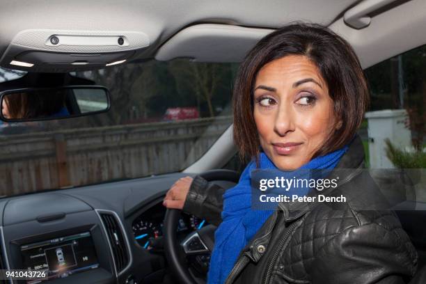 Saira Khan at home with her Ford. She is an English television presenter and celebrity. She was the runner-up on the first UK series of reality...