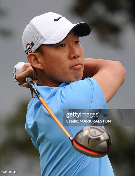 Anthony Kim of the US watches his 2nd hole tee shot at the Sherwood Country Club on day three of the Chevron World Challenge in Thousand Oaks,...