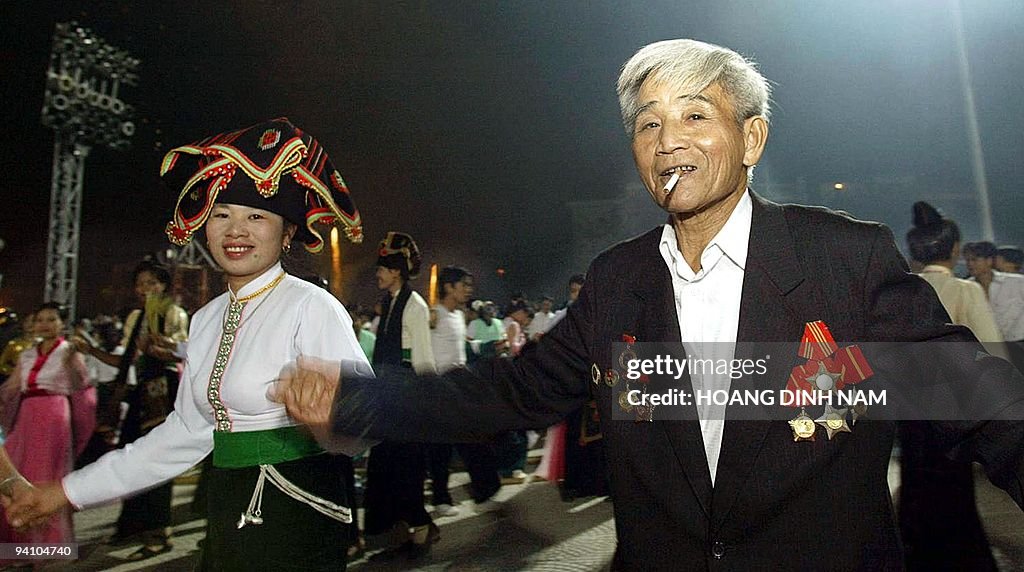 A veteran dances with a Thai ethnic mino