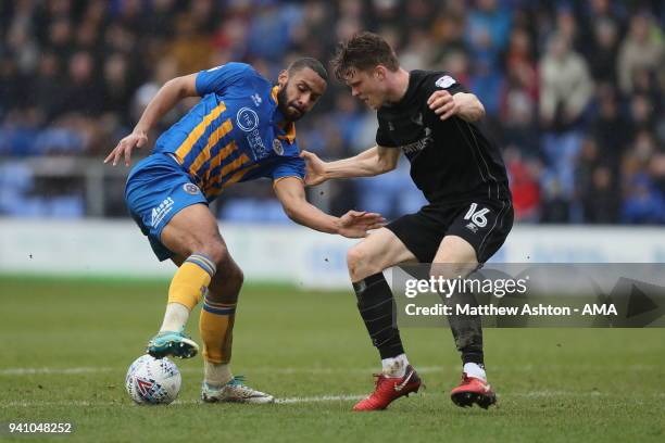 Stefan Payne of Shrewsbury Town and Rob Dickie of Oxford United during the Sky Bet League One match between Shrewsbury Town and Oxford United at New...