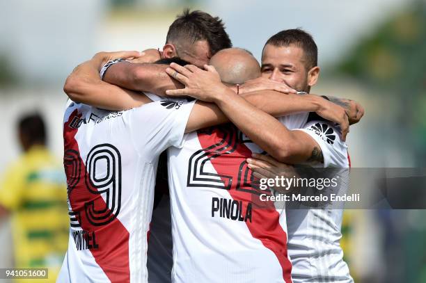 Javier Pinola of River Plate celebrates with teammates after scoring the second goal of his team during a match between Defensa y Justicia and River...