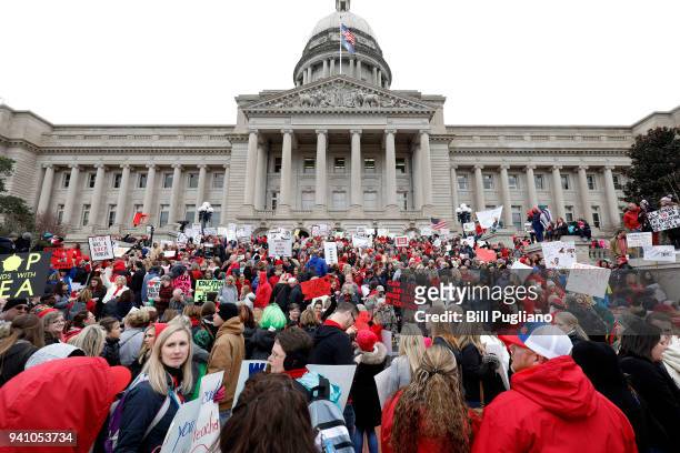 Thousands of public school teachers and their supporters protest against a pension reform bill at the Kentucky State Capitol April 2, 2018 in...