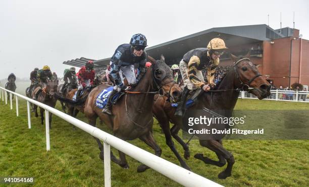 Meath , Ireland - 2 April 2018; Bellshill, with David Mullins up, right, and Jetstream Jack, with Denis O'Regan up, on their first time round along...