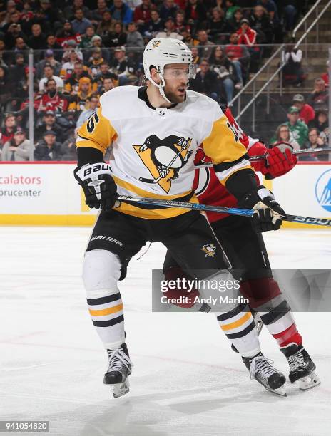 Riley Sheahan of the Pittsburgh Penguins skates during the game against the New Jersey Devils at Prudential Center on March 29, 2018 in Newark, New...