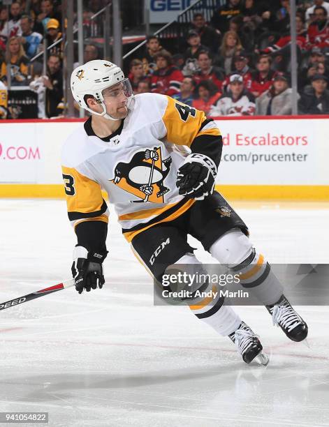 Conor Sheary of the Pittsburgh Penguins skates during the game against the New Jersey Devils at Prudential Center on March 29, 2018 in Newark, New...