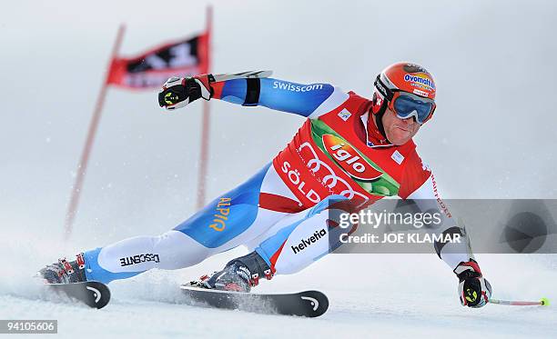 Switzerland's Didier Cuche competes in men's giant slalom during the FIS Alpine Skiing World cup on Rettenbach glacier in Soelden on October 25,...