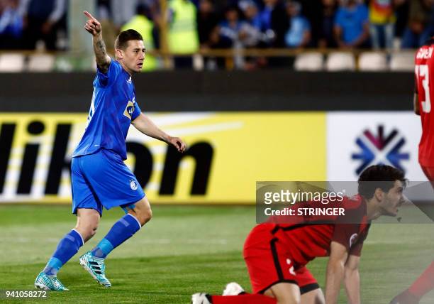 Esteghlal's midfielder Server Djeparov celebrates after opening the scoring during the AFC Champions League football match between Iran's Esteghlal...