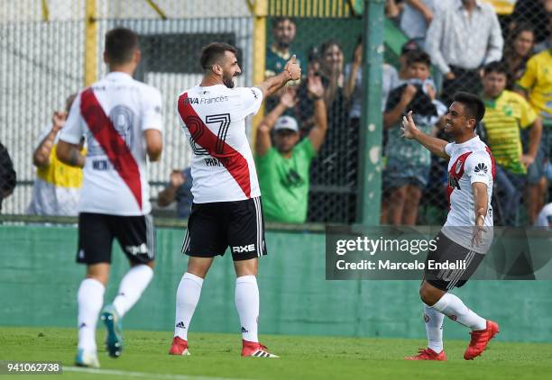 Lucas Pratto of River Plate celebrates with teammate Gonzalo Martinez after scoring the third goal of his team during a match between Defensa y...