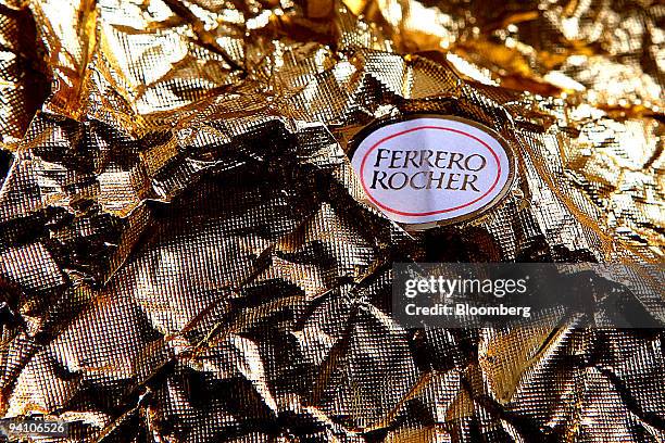 Wrapping from a Fererro Rocher chocolate, produced by Ferrero SpA, sits arranged for a photograph in London, U.K., on Monday, Dec.7, 2009. Hershey...