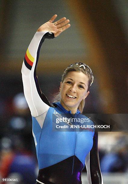 German Anni Friesinger celebrates after winning the women's 1000m race, 16 December 2007 during the speed Skating World Cup at the...