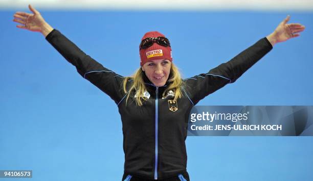 Germany's skater Anni Friesinger celebrates winning the woman 1500m race at the ISU Speed Skating World Cup on January 30, 2009 in the eastern German...