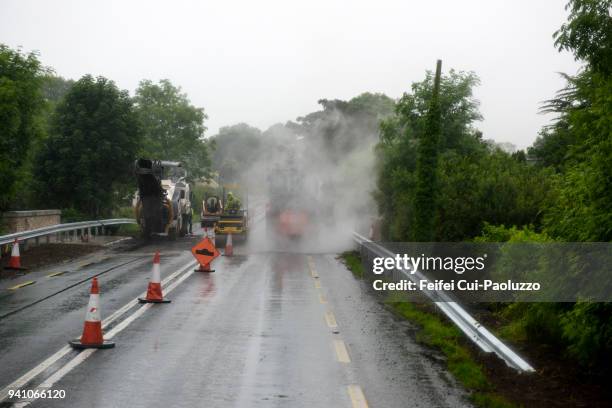 maintenance and repair of road near sligo, county sligo, ireland - schrottpresse stock-fotos und bilder