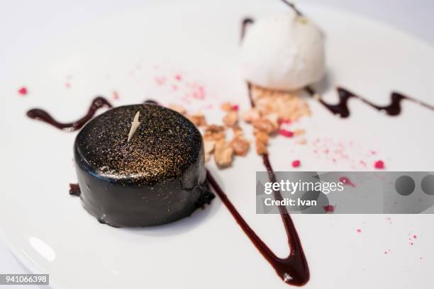 luxury dessert,  chocolate fondant cake  with golden powder - chocolate melting stock pictures, royalty-free photos & images