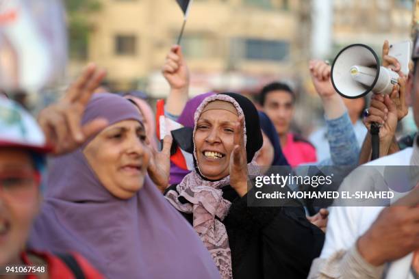 Supporters of Egyptian President Abdel Fattah al-Sisi celebrate in Cairo's Tahrir square following his re-election for a second term, on April 2,...