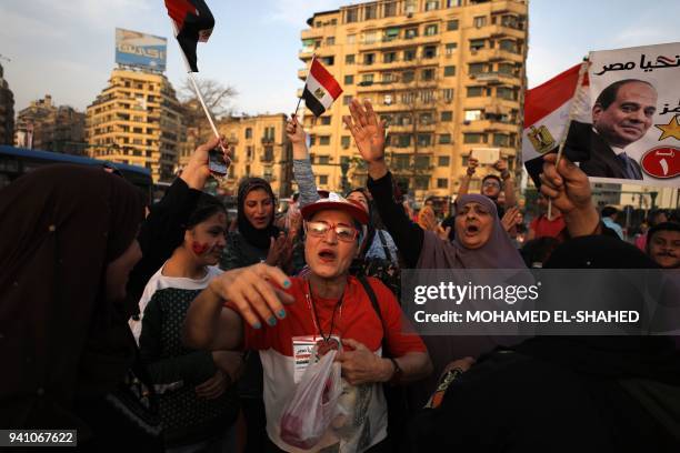 Supporters of Egyptian President Abdel Fattah al-Sisi celebrate in Cairo's Tahrir square following his re-election for a second term, on April 2,...