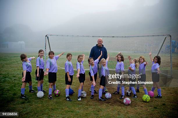 8-year-old girls soccer team portrait - soccer team stock pictures, royalty-free photos & images