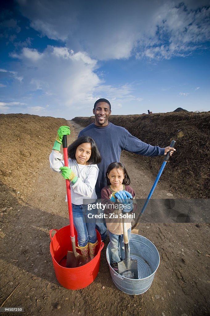 Family loading free mulch from municipal landfill