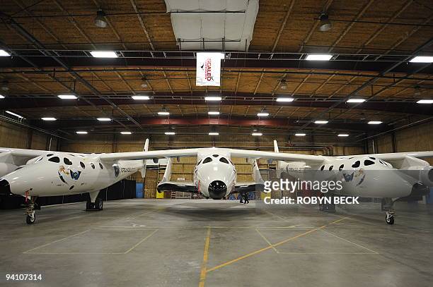 Virgin Galactic's SpaceShipTwo, slung beneath White Knight Two, the twin-fuselage mothership that will carry SpaceShipTwo to launch altitude, on...