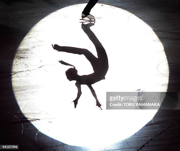 Kim Yu-Na of South Korea is silhouetted on the ice during the exhibition at the ISU Grand Prix Final figure skating in Tokyo on December 6, 2009. Kim...